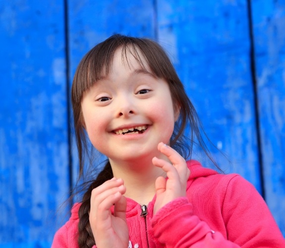 Young girl with special needs smiling
