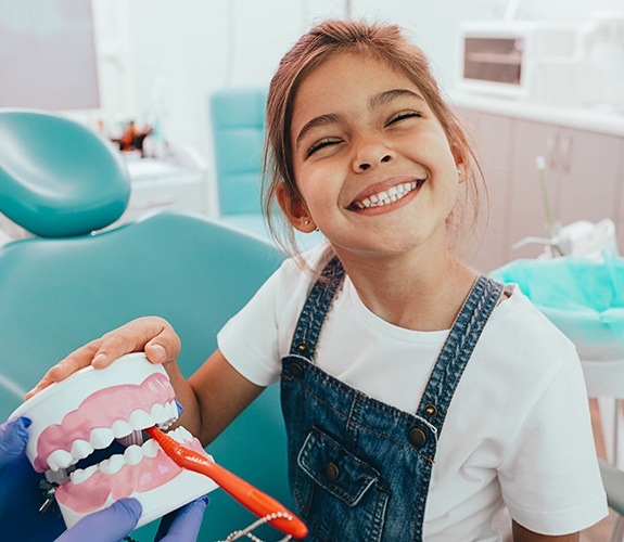 Young girl smiling at a dental checkup with childrens dentist in South Elgin